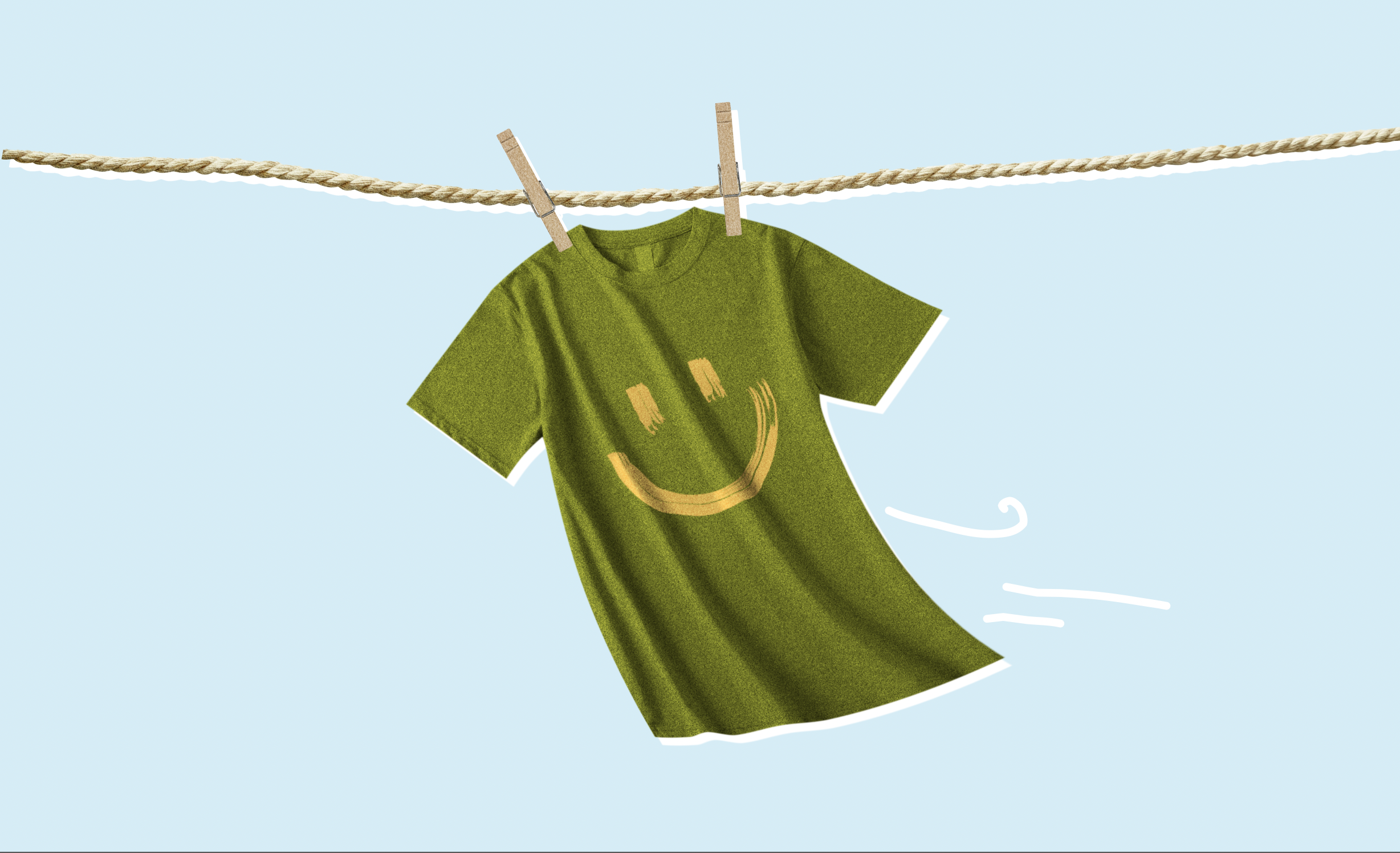 Een shirt met een smiley aan de waslijn, wapperend in de wind
